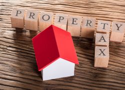 Property,Tax,Wooden,Blocks,With,A,Miniature,House,On,Wooden Property,Tax,Wooden,Blocks,With,A,Miniature,House,On,Wooden