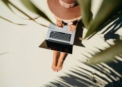 Woman,Working,Through,Internet,In,Tropics.,Working,Remotely,On,The Woman,Working,Through,Internet,In,Tropics.,Working,Remotely,On,The